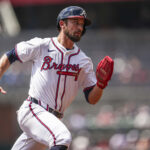 Apr 23, 2025; Cumberland, Georgia, USA; Atlanta Braves outfielder Eli White (36) runs to third base against the St. Louis Cardinals during the second inning at Truist Park. Mandatory Credit: Dale Zanine-Imagn Images