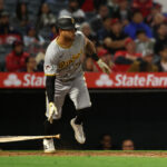 Apr 23, 2025; Anaheim, California, USA; Pittsburgh Pirates left fielder Tommy Pham (28) hits an RBI single during the ninth inning against the Los Angeles Angels at Angel Stadium. Mandatory Credit: Kiyoshi Mio-Imagn Images