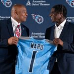 NFL Hall of Fame quarterback Warren Moon, left, poses for pictures with Cam Ward who earlier had been introduced as the Tennessee Titans first-round pick – and overall number one pick – in the NFL Draft at Ascension Saint Thomas Sports Park in Nashville, Tenn., Friday, April 25, 2025. Moon, whose No. 1 jersey is retired for the Tennessee Titans, allowed Ward to wear his number.