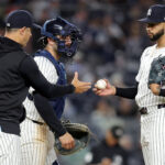Apr 25, 2025; Bronx, New York, USA; New York Yankees manager Aaron Boone (17) takes the ball from relief pitcher Devin Williams (38) during a pitching change during the ninth inning against the Toronto Blue Jays at Yankee Stadium. Mandatory Credit: Brad Penner-Imagn Images
