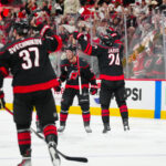 Apr 29, 2025; Raleigh, North Carolina, USA; Carolina Hurricanes center Sebastian Aho (20) scores the game wining goal in the second overtime against the New Jersey Devils in game five of the first round of the 2025 Stanley Cup Playoffs at Lenovo Center. Mandatory Credit: James Guillory-Imagn Images