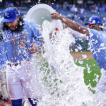 Apr 10, 2025; Kansas City, Missouri, USA; Kansas City Royals third baseman Jonathan India (6) his doused by left fielder MJ Melendez (1) and shortstop Bobby Witt Jr. (7) after the win over the Minnesota Twins at Kauffman Stadium.