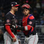 Apr 16, 2025; Pittsburgh, Pennsylvania, USA; Washington Nationals relief pitcher Jorge Lopez (21) is restrained by catcher Keibert Ruiz (20) as Lopez has words with Pittsburgh Pirates right fielder Andrew McCutchen (not pictured) during the seventh inning at PNC Park.