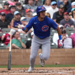Mar 3, 2025; Salt River Pima-Maricopa, Arizona, USA; Chicago Cubs second baseman Nicky Lopez hits a double against the Arizona Diamondbacks in the second inning at Salt River Fields at Talking Stick.