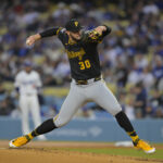 Apr 25, 2025; Los Angeles, California, USA; Pittsburgh Pirates starting pitcher Paul Skenes (30) pitches during the first inning against the Los Angeles Dodgers at Dodger Stadium.