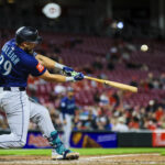 Apr 16, 2025; Cincinnati, Ohio, USA; Seattle Mariners catcher Cal Raleigh (29) hits a solo home run in the seventh inning against the Cincinnati Reds at Great American Ball Park.