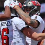 Sep 17, 2023; Tampa, Florida, USA; Tampa Bay Buccaneers wide receiver Mike Evans (13) is congratulated by quarterback Baker Mayfield (6) after scoring a touchdown against the Chicago Bears during the second half at Raymond James Stadium. Mandatory Credit: Kim Klement Neitzel-USA TODAY Sports