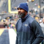 Michigan legend Charles Woodson waves at fans during warmup at the spring game at Michigan Stadium in Ann Arbor on Saturday, April 20, 2024.