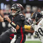 Sep 8, 2024; Atlanta, Georgia, USA; Pittsburgh Steelers linebacker T.J. Watt (90) strips the ball from Atlanta Falcons quarterback Kirk Cousins (18) at Mercedes-Benz Stadium.