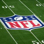 Oct 13, 2024; London, United Kingdom; The NFL shield logo at midfield before an NFL International Series game at Tottenham Hotspur Stadium. Mandatory Credit: Kirby Lee-Imagn Images