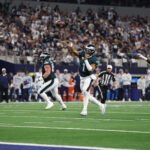 Nov 10, 2024; Arlington, Texas, USA; Philadelphia Eagles quarterback Jalen Hurts (1) throws a touchdown pass against the Dallas Cowboys in the third quarter at AT&T Stadium. Mandatory Credit: Tim Heitman-Imagn Images