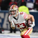 Dec 1, 2024; Orchard Park, New York, USA; San Francisco 49ers running back Christian McCaffrey (23) warms up before a game against the Buffalo Bills at Highmark Stadium.