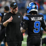 Dec 15, 2024; Detroit, Michigan, USA; Detroit Lions head coach Dan Campbell greets wide receiver Jameson Williams (9) during pregame warmups before their game against the Buffalo Bills at Ford Field.