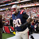 Dec 15, 2024; Glendale, Arizona, USA; New England Patriots defensive tackle Christian Barmore (90) against the Arizona Cardinals at State Farm Stadium. Mandatory Credit: Mark J. Rebilas-Imagn Images