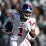 Jan 5, 2025; Philadelphia, Pennsylvania, USA; New York Giants wide receiver Malik Nabers (1) runs with the ball against the Philadelphia Eagles during the first quarter at Lincoln Financial Field.