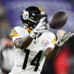 Jan 11, 2025; Baltimore, Maryland, USA; Pittsburgh Steelers wide receiver George Pickens (14) makes a catch against the Baltimore Ravens in the third quarter in an AFC wild card game at M&T Bank Stadium. Mandatory Credit: Tommy Gilligan-Imagn Images