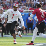 Feb 2, 2025; Orlando, FL, USA; AFC wide receiver Ja'Marr Chase of the Cincinnatti Bengals (1) carries the ball against NFC strong safety Budda Baker of the Arizona Cardinals (3)during the 2025 Pro Bowl Games at Camping World Stadium. Mandatory Credit: Kirby Lee-Imagn Images NFL
