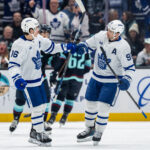 Feb 6, 2025; Seattle, Washington, USA; Toronto Maple Leafs forward Mitch Marner (16) and forward John Tavares (91) celebrate a goald during the first period against the Seattle Kraken at Climate Pledge Arena. Mandatory Credit: Stephen Brashear-Imagn Images