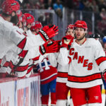 Apr 16, 2025; Montreal, Quebec, CAN; Carolina Hurricanes left wing Taylor Hall (71) celebrates with his teammates at the bench his goal against the Montreal Canadiens in the first period at Bell Centre. Mandatory Credit: David Kirouac-Imagn Images