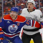 May 1, 2025; Edmonton, Alberta, CAN; Edmonton Oilers forward Connor McDavid (97) and Los Angeles Kings defensemen Mikey Anderson (44) battles for position during the third period in game six of the first round of the 2025 Stanley Cup Playoffs at Rogers Place.