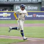 May 6, 2025; Milwaukee, Wisconsin, USA; Milwaukee Brewers catcher William Contreras (24) scores a run against the Houston Astros in the first inning at American Family Field. Mandatory Credit: Michael McLoone-Imagn Images