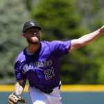 May 8, 2025; Denver, Colorado, USA; Colorado Rockies starting pitcher Kyle Freeland (21) delivers a pitch in the first inning against the Detroit Tigers at Coors Field. Mandatory Credit: Ron Chenoy-Imagn Images