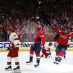 May 8, 2025; Washington, District of Columbia, USA; Washington Capitals right wing Tom Wilson (43) celebrates with Capitals center Nic Dowd (26) after scoring an empty net goal as Carolina Hurricanes right wing Jackson Blake (53) looks on in the third period in game two of the second round of the 2025 Stanley Cup Playoffs at Capital One Arena. Mandatory Credit: Geoff Burke-Imagn Images