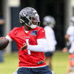 May 10, 2025; Nashville, TN, USA; Tennessee Titans quarterback Cam Ward (1) throws a pass as he goes through drills during Rookie Mini Camp at Saint Thomas Sports Park. Mandatory Credit: Steve Roberts-Imagn Images