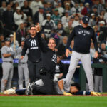 May 12, 2025; Seattle, Washington, USA; Trainers tend to New York Yankees third baseman Oswaldo Cabrera (95) after being injured while scoring a run against the Seattle Mariners during the ninth inning at T-Mobile Park. Mandatory Credit: Steven Bisig-Imagn Images