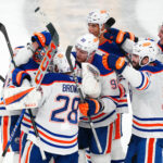 May 14, 2025; Las Vegas, Nevada, USA; Edmonton Oilers goaltender Stuart Skinner (74) celebrates with team mates after the Oilers defeated the Vegas Golden Knights 1-0 during an overtime victory, completing a 4-1 series win during game five of the second round of the 2025 Stanley Cup Playoffs at T-Mobile Arena. Mandatory Credit: Stephen R. Sylvanie-Imagn Images