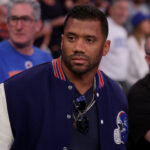 May 16, 2025; New York, New York, USA; New York Giants quarterback Russell Wilson stands courtside during the fourth quarter of game six in the second round of the 2025 NBA Playoffs between the New York Knicks and the Boston Celtics at Madison Square Garden.