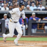 May 18, 2025; Bronx, New York, USA; New York Yankees left fielder Cody Bellinger (35) hits a two-run double in the first inning against the New York Mets at Yankee Stadium. Mandatory Credit: Wendell Cruz-Imagn Images