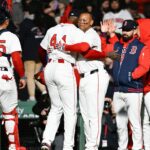 May 19, 2025; Boston, Massachusetts, USA; Boston Red Sox designated hitter Rafael Devers (11) celebrates beating the New York Mets with relief pitcher Aroldis Chapman (44) at Fenway Park. Mandatory Credit: Eric Canha-Imagn Images