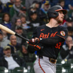 May 21, 2025; Milwaukee, Wisconsin, USA; Baltimore Orioles first baseman Ryan O'Hearn (32) drives in a run with a base hit in the fourth inning against the Milwaukee Brewers at American Family Field. Mandatory Credit: Benny Sieu-Imagn Images