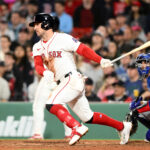 May 7, 2025; Boston, Massachusetts, USA; Boston Red Sox third baseman Alex Bregman (2) hits a two-run RBI single against the Texas Rangers during the seventh inning at Fenway Park.