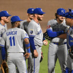 Apr 30, 2025; St. Petersburg, Florida, USA; Kansas City Royals starting pitcher Noah Cameron (65) reacts as his teammates join him on the mound after he gave up his first hit of the night in the seventh inning against the Tampa Bay Rays at George M. Steinbrenner Field.