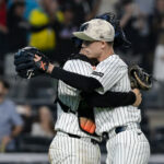 May 16, 2025; Bronx, New York, USA; New York Yankees catcher Austin Wells (28) embraces pitcher Luke Weaver (30) after winning against the New York Mets at Yankee Stadium.