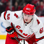 Apr 16, 2025; Montreal, Quebec, CAN; Carolina Hurricanes left wing Eric Robinson (50) waits for a face-off against the Montreal Canadiens in the second period at Bell Centre