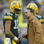 Nov 5, 2023; Green Bay, Wisconsin, USA; Green Bay Packers head coach Matt LaFleur talks with quarterback Jordan Love (10) during the second quarter against the Los Angeles Rams at Lambeau Field.