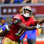 Sep 22, 2024; Inglewood, California, USA; San Francisco 49ers wide receiver Brandon Aiyuk (11) misses catching a pass agianst the Los Angeles Rams during the first half at SoFi Stadium. Mandatory Credit: Gary A. Vasquez-Imagn Images