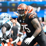 Sep 29, 2024; Charlotte, North Carolina, USA; Cincinnati Bengals offensive tackle Orlando Brown Jr. (75) blocks as Carolina Panthers linebacker Charles Harris (40) rushes in the first quarter at Bank of America Stadium. Mandatory Credit: Bob Donnan-Imagn Images