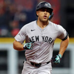 Oct 19, 2024; Cleveland, Ohio, USA; New York Yankees designated hitter Giancarlo Stanton (27) runs the bases after hitting a two run home run during the sixth inning against the Cleveland Guardians during game five of the ALCS for the 2024 MLB playoffs at Progressive Field. Mandatory Credit: Scott Galvin-Imagn Images