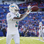 Nov 3, 2024; Orchard Park, New York, USA; Miami Dolphins cornerback Jalen Ramsey (5) warms up prior to the game against the Buffalo Bills at Highmark Stadium. Mandatory Credit: Gregory Fisher-Imagn Images