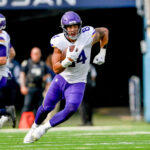 Nov 17, 2024; Nashville, Tennessee, USA; Minnesota Vikings tight end Josh Oliver (84) runs the ball after a made catch against the Tennessee Titans during the first half at Nissan Stadium.
