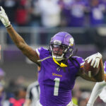 Dec 1, 2024; Minneapolis, Minnesota, USA; Minnesota Vikings cornerback Shaquill Griffin (1) celebrates his interception against the Arizona Cardinals in the fourth quarter at U.S. Bank Stadium. Mandatory Credit: Brad Rempel-Imagn Images