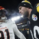 Jan 4, 2025; Pittsburgh, Pennsylvania, USA; Cincinnati Bengals defensive end Trey Hendrickson (91) and Pittsburgh Steelers linebacker T.J. Watt (90) talk after the game at Acrisure Stadium. Mandatory Credit: Charles LeClaire-Imagn Images