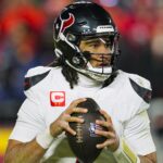 Jan 18, 2025; Kansas City, Missouri, USA; Houston Texans quarterback C.J. Stroud (7) drops back to pass during the second half against the Kansas City Chiefs in a 2025 AFC divisional round game at GEHA Field at Arrowhead Stadium. Mandatory Credit: Jay Biggerstaff-Imagn Images