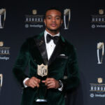 Feb 6, 2025; New Orleans, LA, USA; Denver Broncos cornerback Patrick Surtain II poses with the Defensive Player of the Year award during Super Bowl LIX NFL Honors at Saenger Theatre. Mandatory Credit: Kirby Lee-Imagn Images