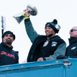 Feb 14, 2025; Philadelphia, PA, USA; Philadelphia Eagles running back Saquon Barkley (26) lifts the Lombardi Trophy during the Super Bowl LIX championship parade and rally. Mandatory Credit: Caean Couto-Imagn Images