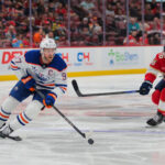 Feb 27, 2025; Sunrise, Florida, USA; Edmonton Oilers center Connor McDavid (97) moves the puck past Florida Panthers center Aleksander Barkov (16) during the first period at Amerant Bank Arena. Mandatory Credit: Sam Navarro-Imagn Images